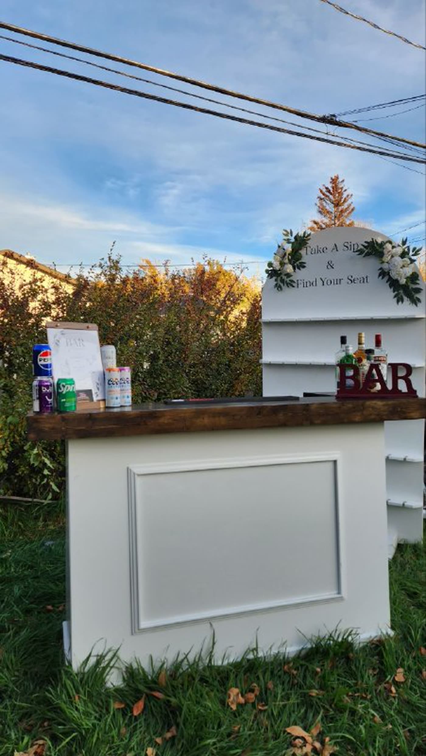 White collapsible pop-up bar with red BAR letters